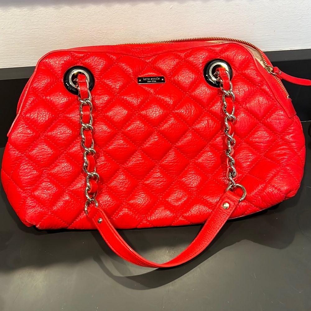 Bright red quilted leather Kate Spade purse with gold details
